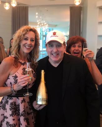 Lisa Dwoskin with Ron Goldberg of Lamborghini Champagne