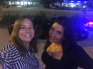 Italian American Realtors Venus Proffer Baretta and MJ Sanzari proud members of Luxury Chamber in front of a Ferrari at Crazy Uncle Mikes in Boca Raton