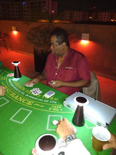 Luxury Chamber's Chris Cie Carter dealing cards at our rooftop party